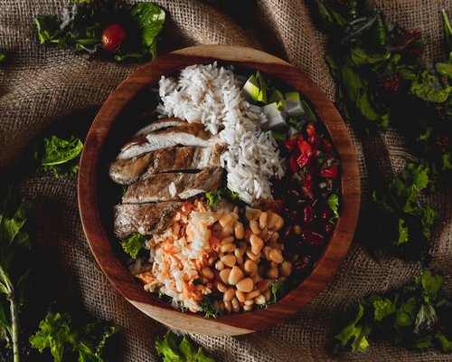 Healthy bowl with fresh vegetables and avocado